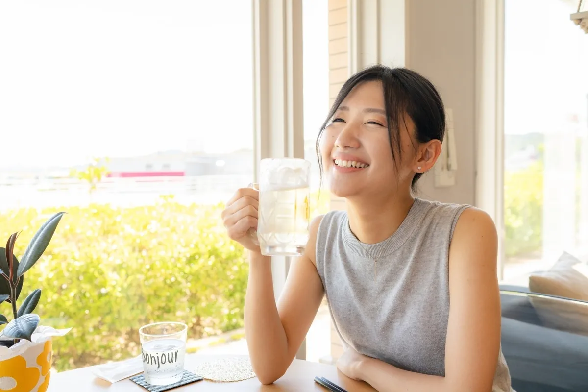 Woman enjoying a highball