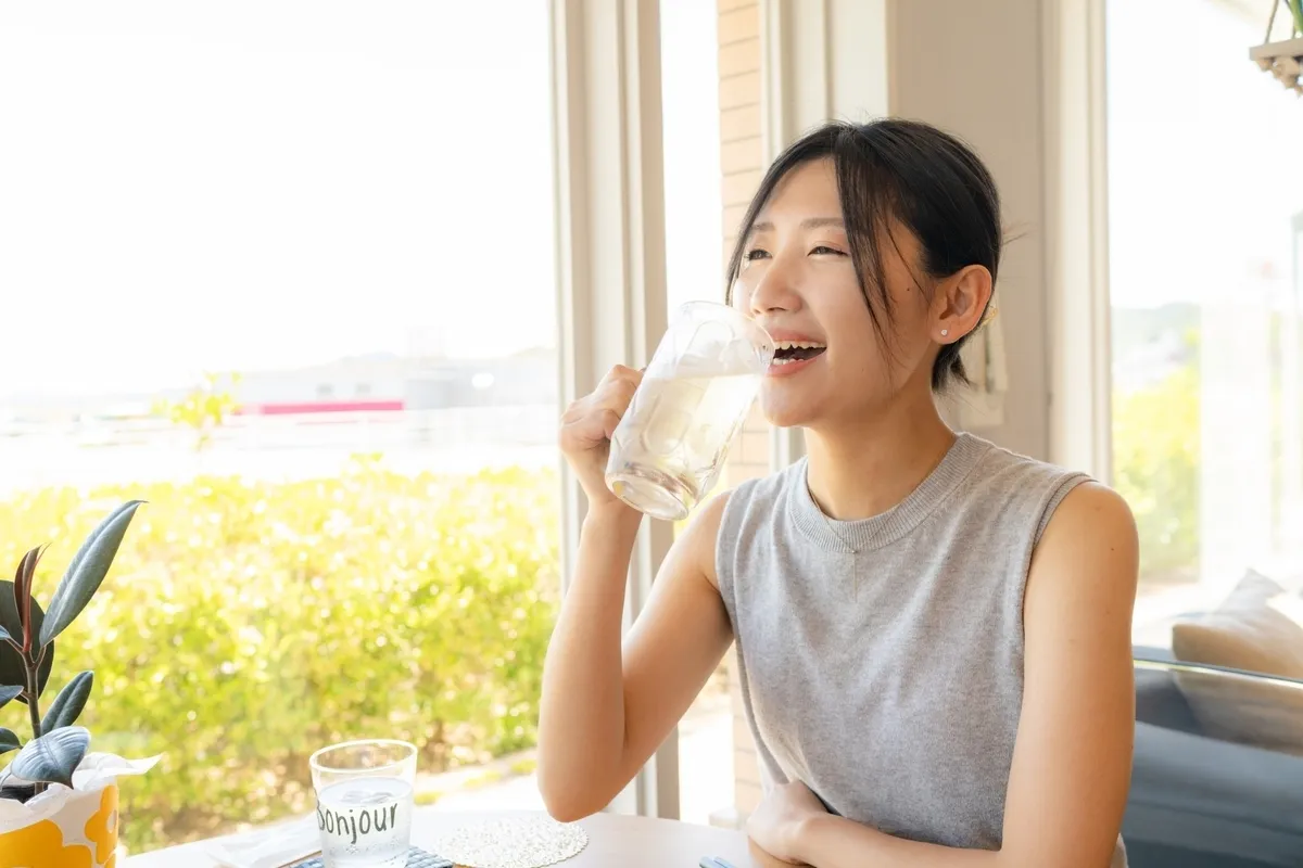 Woman enjoying a highball